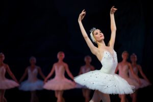 Ballerinas perform on stage.