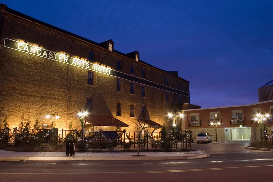 front view of the Lancaster Arts Hotel at night